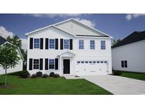 New two-story home with attached garage and landscaping at 667 Mccorkle Place, Conway, SC 29526