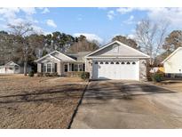 Charming single-story home with stone and vinyl siding, well-maintained lawn, and a two-car garage at 1412 Gailard Dr., Conway, SC 29526