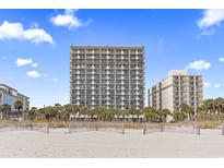 Stunning exterior view of oceanfront high-rise condominium complex with palm trees at 2300 N Ocean Blvd. # 1037, Myrtle Beach, SC 29577