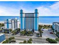 Beautiful blue and white oceanfront building with convenient parking and stunning beach access at 2300 N Ocean Blvd. # 1037, Myrtle Beach, SC 29577