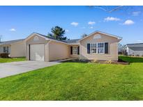 Charming single-story home with a well-maintained lawn and attached one car garage at 2483 Morlynn Dr., Myrtle Beach, SC 29577