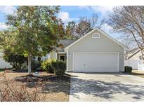 Charming single-Gathering home featuring a two-car garage and well-maintained landscaping at 4689 Southgate Pkwy., Myrtle Beach, SC 29579