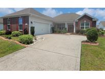 Charming single-story home with brick accents, manicured landscaping, and a wide driveway at 5318 Tremiti Ln., Myrtle Beach, SC 29579