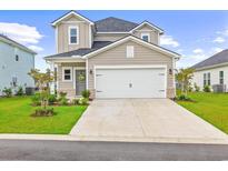 Charming two-story home with neutral siding, white garage doors, and manicured front yard at 2321 Copper Creek Loop, Longs, SC 29568