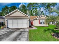 Charming single-story home with well-manicured lawn and attached two car garage at 305 Aqua Vista Ct., Myrtle Beach, SC 29588