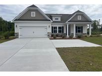 Charming single-Gathering home with a two-car garage and neutral exterior paint scheme at 7059 Shady Grove Rd., Conway, SC 29527