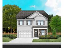 Charming two-story home with a stone-accented facade, attached garage, and well-manicured lawn at 990 Oak Hollow St., Longs, SC 29568