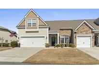 Charming townhome with attached garages and a manicured front yard at 135 Parmelee Dr. # A, Murrells Inlet, SC 29576