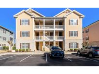 Inviting condo exterior features double balconies, complementary landscaping, and convenient parking at 178 Clubhouse Dr. # 3, Sunset Beach, NC 28468