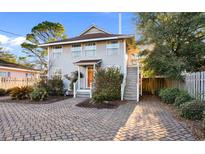 Charming two-story home with a brick driveway and welcoming front porch at 607 18Th Ave. S, North Myrtle Beach, SC 29582