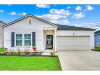 Charming single-Gathering home with a well-manicured lawn, two-car garage, and inviting front entrance at 694 Harrison Mill St., Myrtle Beach, SC 29579