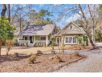 Charming home with a covered porch, inviting entrance, and well-maintained yard at 1444 Will-Go Ave., Murrells Inlet, SC 29576