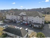 Spacious condo building with beautiful landscaping, a large parking lot, and golf course views in a great community at 2241 Waterview Dr. # 527, North Myrtle Beach, SC 29582