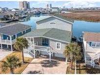 Beautiful waterfront home with a lush yard, two car garage, and stunning water views at 323 45Th Ave. N, North Myrtle Beach, SC 29582