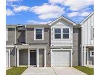 Charming townhome with a one-car garage and a welcoming front porch at 327 Sandridgebury Dr. # 72, Little River, SC 29566