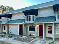 Two-story condos featuring balconies, gray siding and dark shingled roofs at 801 Burcale Rd. # G-5, Myrtle Beach, SC 29579