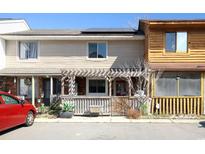 Charming townhouse showcasing a covered front porch and solar panels on the roof at 1424 Glenns Bay Rd. # 1424, Myrtle Beach, SC 29575