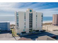 Coastal condo building with classic lines, balconies, and ocean views in sunny Myrtle Beach, South Carolina at 1425 S Ocean Blvd. # 7C, North Myrtle Beach, SC 29582