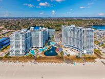 Stunning aerial view of beachfront condos with multiple pools and water features at 158 Seawatch Dr. # 1112, Myrtle Beach, SC 29572