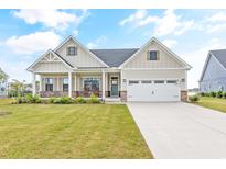 Charming single Gathering home with a well-manicured lawn, covered porch, and attached two car garage at 2609 Turchino Ct., Myrtle Beach, SC 29579