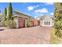 Inviting home exterior with brick driveway, two-car garage and lovely landscaping at 1341 Waterway Dr., North Myrtle Beach, SC 29582