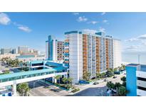Stunning beachfront condo building featuring a pedestrian bridge and panoramic ocean views at 1501 S Ocean Blvd. # 633, Myrtle Beach, SC 29577