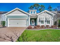 Charming home exterior featuring a well-manicured lawn and two-car garage and attractive front yard at 1903 Francis Ct., Myrtle Beach, SC 29577