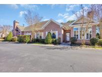 Well-maintained brick building with manicured landscaping and ample parking at 2019 Balfour Ct. # L4, Myrtle Beach, SC 29575