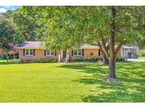 Charming brick ranch-style home with a well-manicured lawn and lush landscaping, offering great curb appeal at 2070 Harris Short Cut Rd., Conway, SC 29526