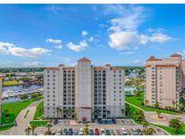 Stunning aerial view of a condominium complex boasting lush lawns, marina and resort-style swimming pools at 2151 Bridge View Ct. # 1-803, North Myrtle Beach, SC 29582