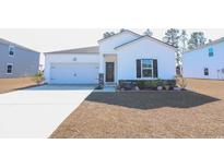 Charming single-story home featuring a two-car garage and a welcoming front porch at 244 Carolina Lakes Blvd., Myrtle Beach, SC 29588