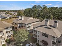 Charming condos featuring balconies, mature trees, and well-maintained grounds in a desirable community at 4230 Pinehurst Circle # K-8, Little River, SC 29566
