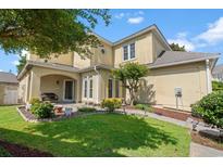 Charming home featuring a landscaped front yard, covered entry, and well-maintained garden at 4306 Windy Heights Dr., North Myrtle Beach, SC 29582
