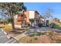 Charming condo features a walkway leading up to the front door, a fenced in front yard, and a second story balcony at 614 15Th Ave. S # 42, Surfside Beach, SC 29575