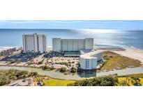 Expansive aerial view of a beautiful oceanfront resort with multiple buildings and ample parking at 9400 Shore Dr. # 722, Myrtle Beach, SC 29572