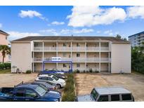 Condo exterior showcasing building layout with parking and unit 2A highlighted at 3308 S Ocean Blvd. # 2-A, North Myrtle Beach, SC 29582