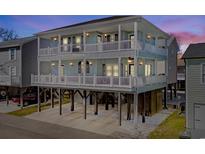 Beautiful raised beach home with multiple decks for enjoying coastal views and outdoor living at 6001 - 8022 S Kings Hwy., Myrtle Beach, SC 29575