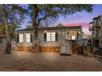 Charming single story home with a front porch, and mature trees in a well-maintained yard at 6001 - N84 S Kings Hwy., Myrtle Beach, SC 29575