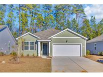 Charming single-story home with a two-car garage and a well-manicured lawn at 609 Gryffindor Dr., Longs, SC 29568