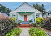 Charming home with a colorful front door, brick steps, and well-maintained landscaping at 632 Magnolia Dr., Georgetown, SC 29440