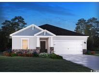 Charming one-story home boasts stone accents, neutral siding, complemented by a well-manicured lawn at 1230 Arizona Dr., Longs, SC 29568