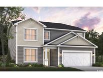 Charming two-story home with a two-car garage, landscaped yard, and a mix of vertical and shake siding at 1267 Safe Haven Dr., Myrtle Beach, SC 29579