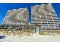 Beautiful view of a tall resort condo featuring multiple stories and balconies facing the sandy beach at 1625 S Ocean Blvd. # 1109, North Myrtle Beach, SC 29582