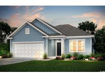 Charming one-story home featuring light blue siding, a white garage door, and a well-manicured lawn at 285 Eagle Claw Dr., Calabash, NC 28467
