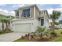 Charming two-story home boasts a well-manicured lawn and an attached garage with lots of curb appeal at 508 Chanted Dr., Murrells Inlet, SC 29576