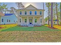 Charming two-story home with a welcoming front porch and manicured lawn at 82 Bridgeview Rd., Georgetown, SC 29440