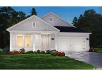 Charming single-Gathering home features a light-colored exterior, a two-car garage, and well-manicured landscaping at 933 Maya Layne Dr., Little River, SC 29566