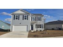 Charming two-story home with gray siding, black shutters, and a well-manicured lawn showcasing curb appeal at 1114 Black Lake Way, Conway, SC 29526