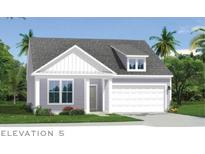 Charming two-story home featuring a covered front porch, gray siding, and a well-manicured lawn at 155 Joyce Dr, Longs, SC 29568