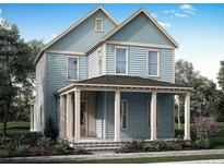 Charming two-story blue home with a welcoming front porch and classic architectural details at 1587 Sayebrook Pkwy., Myrtle Beach, SC 29588